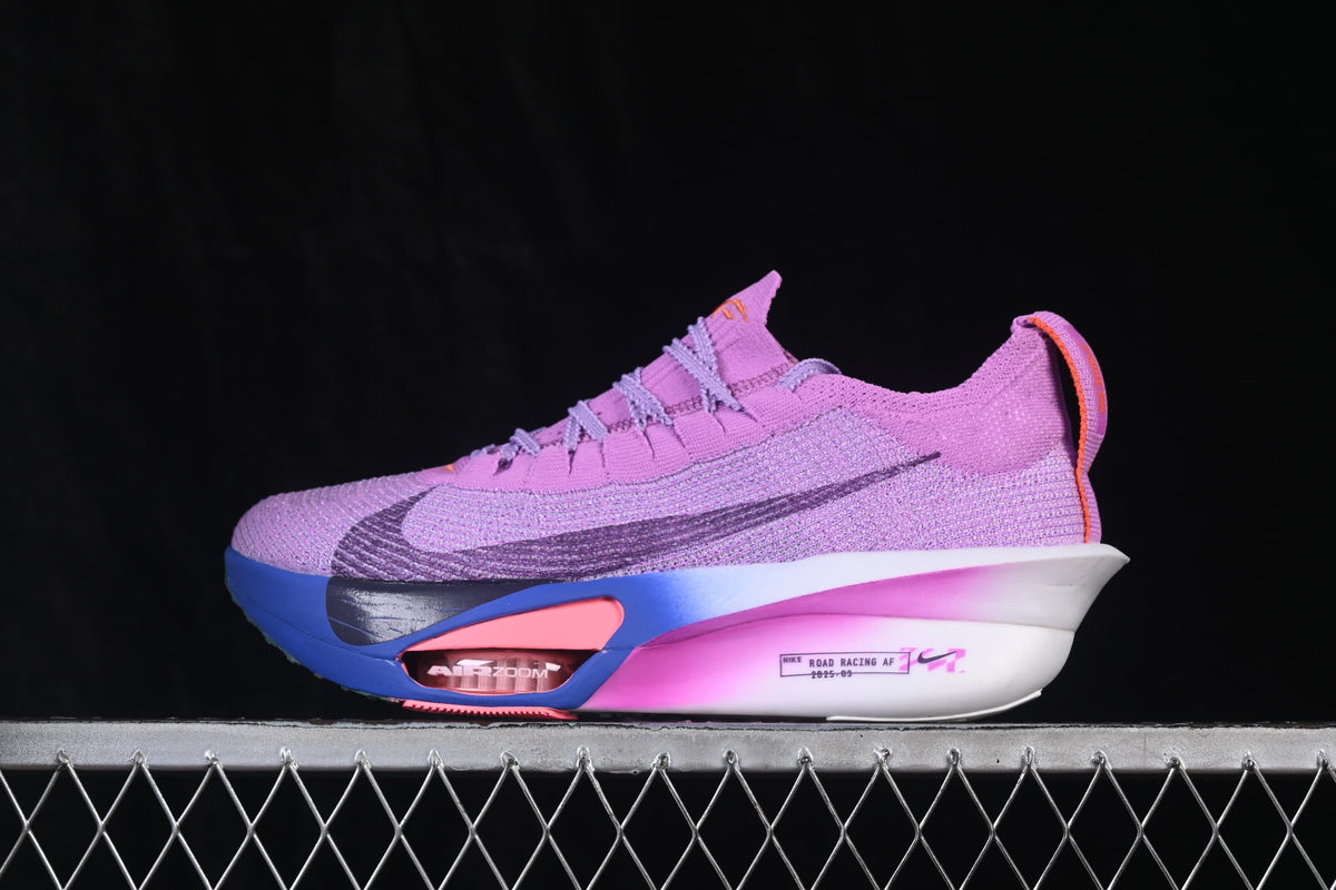 Side view of a purple Nike road-running shoe with blue, pink, and white sole accents.