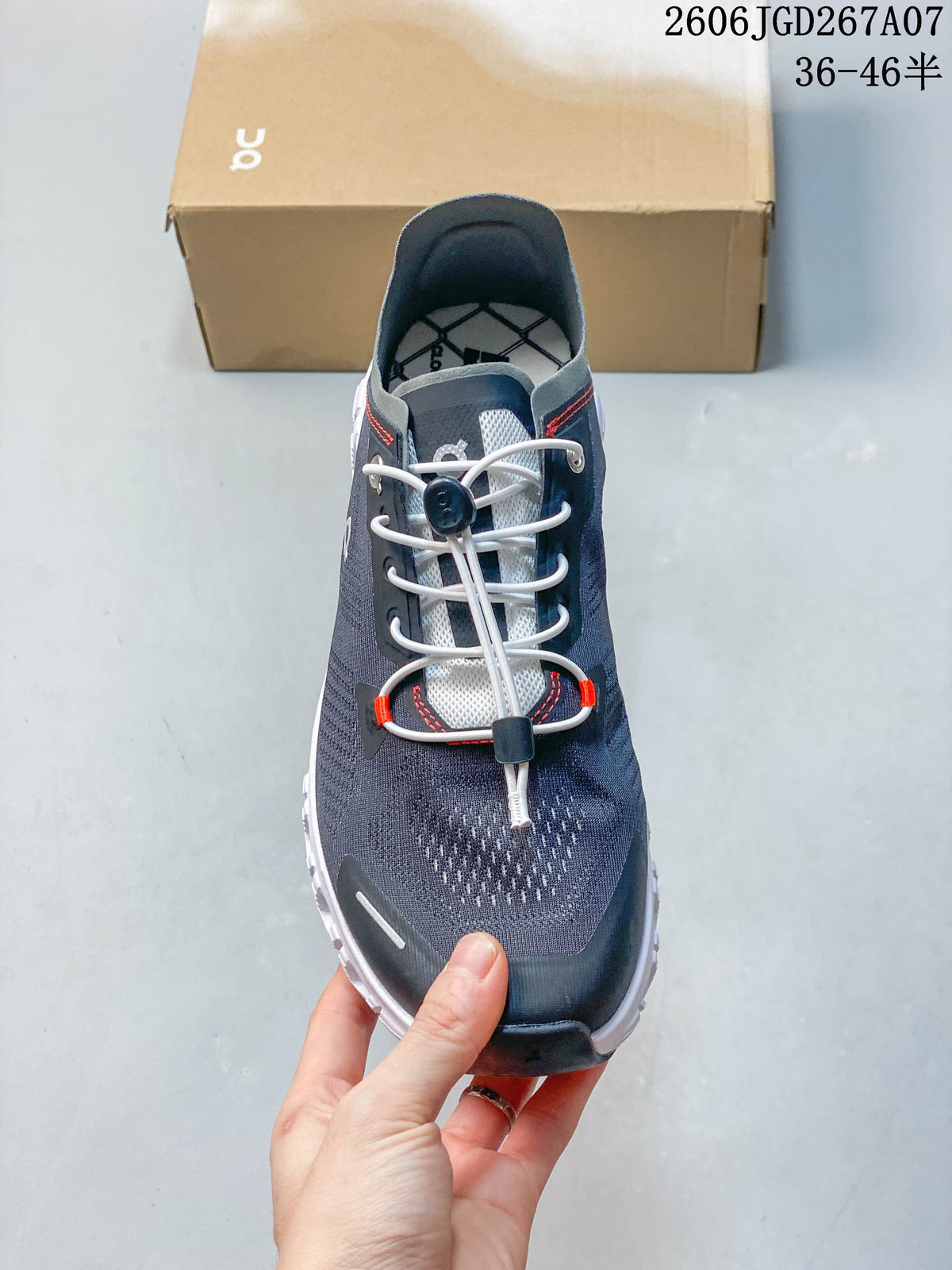 Front view highlighting the toggle-style laces and gray upper.
