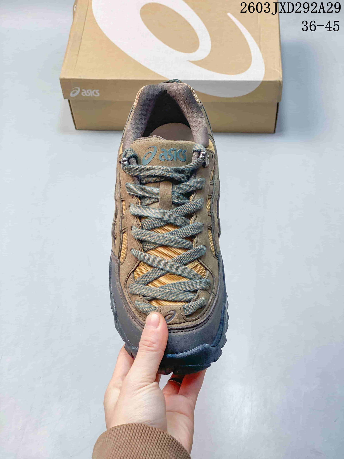 Top view of an ASICS Gel-Pickax sneaker showing its laces, metal lace hooks, and color-blocked upper.