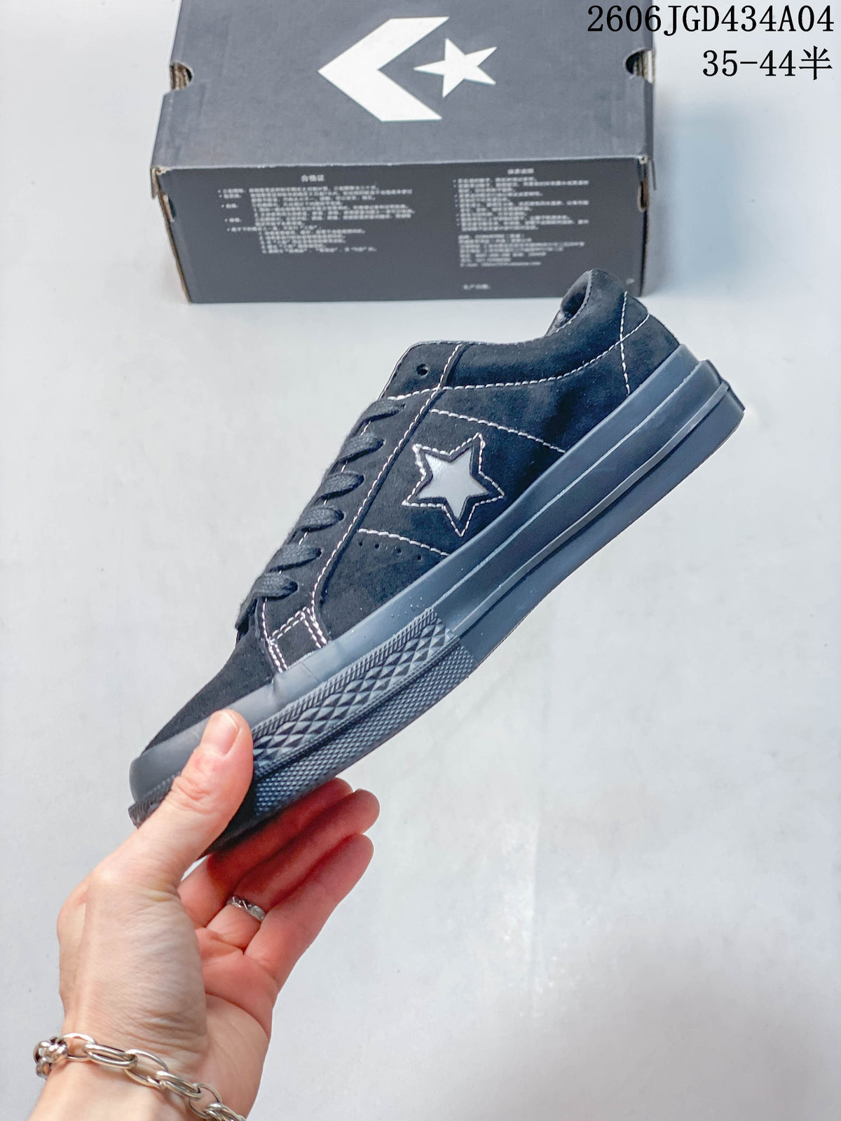 Side profile showing the star emblem and contrast stitching on the Converse One Star Pro.