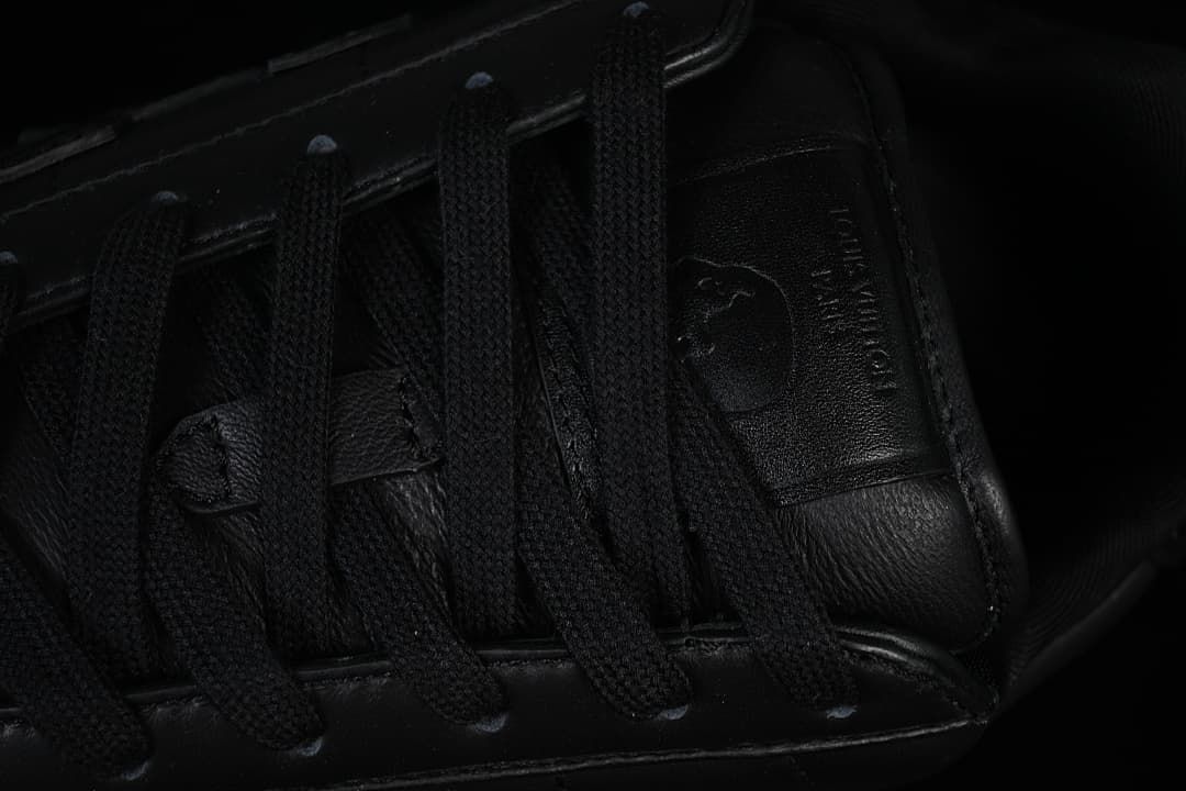 Close-up of black laces and tongue details