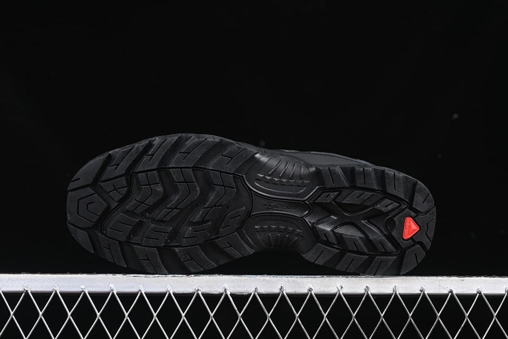 Underside view showing the tread pattern and red heel accent.