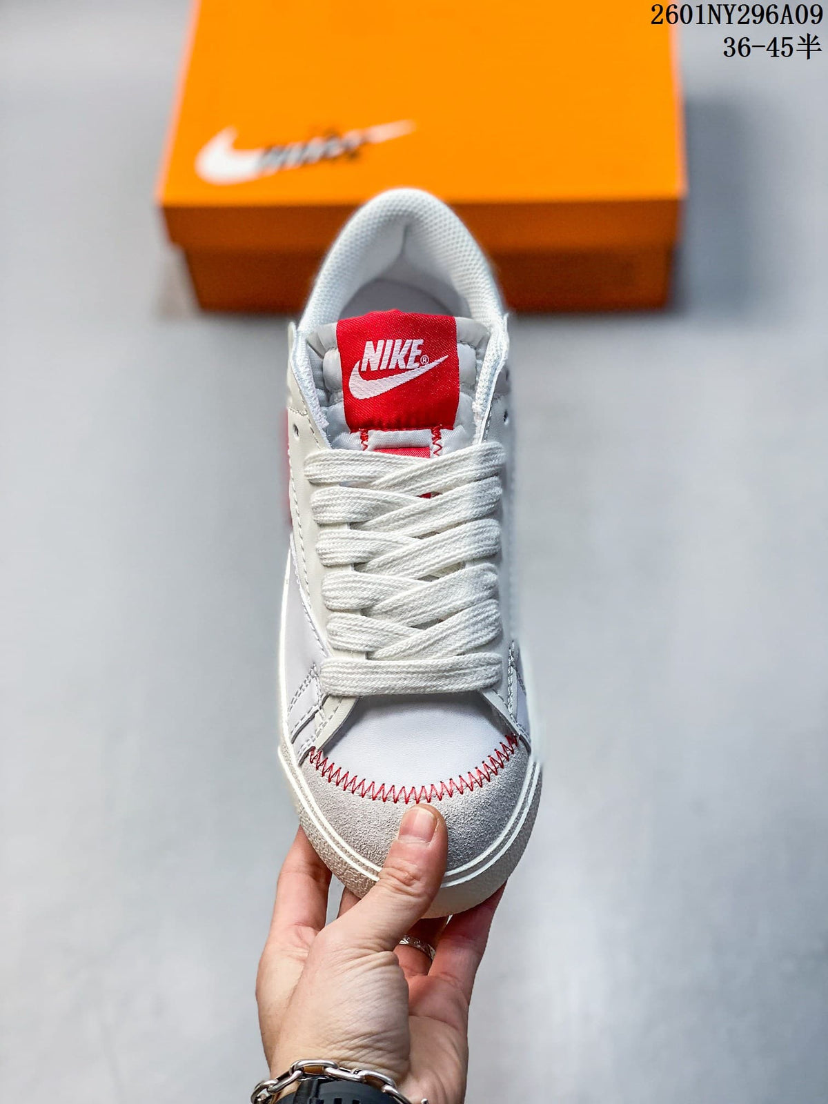 Front view highlighting the red tongue label, wide laces, and contrast toe stitching.