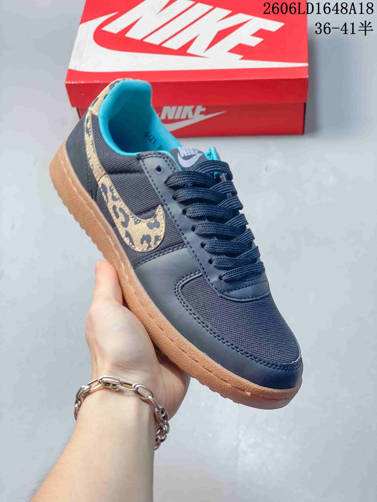 Angled view of the sneaker showing its leopard-print Swoosh and gum-colored sole