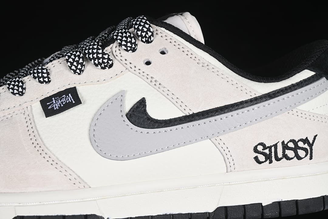 Close-up of the grey Swoosh, patterned laces, and side branding