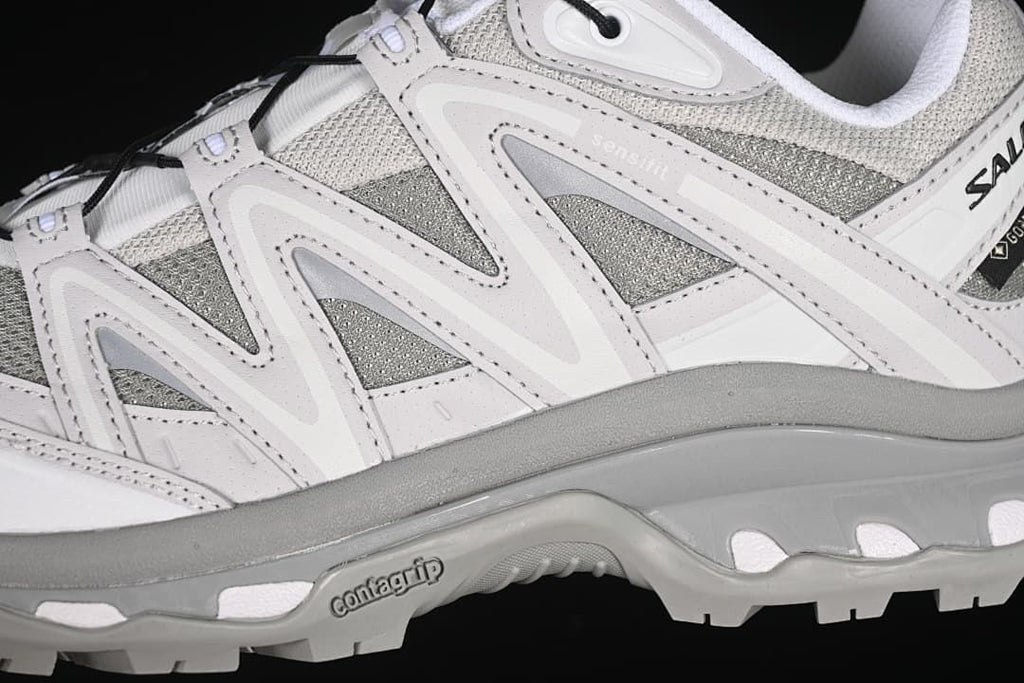 Close-up of side panels, mesh sections, and Contagrip outsole branding