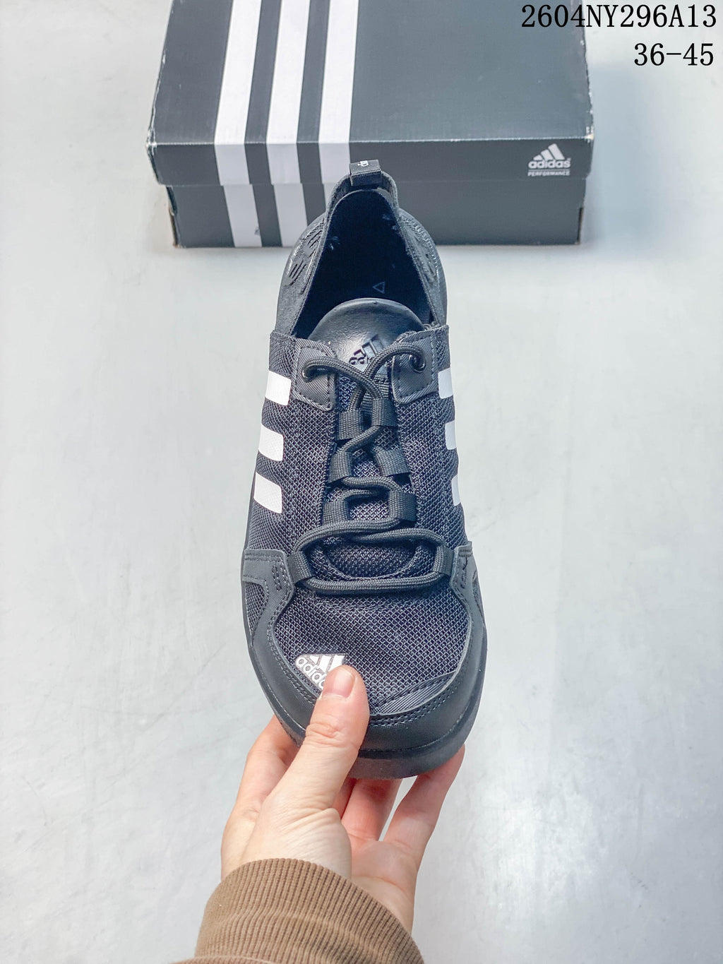 Front view of a dark grey adidas Terrex shoe with lace-up fastening