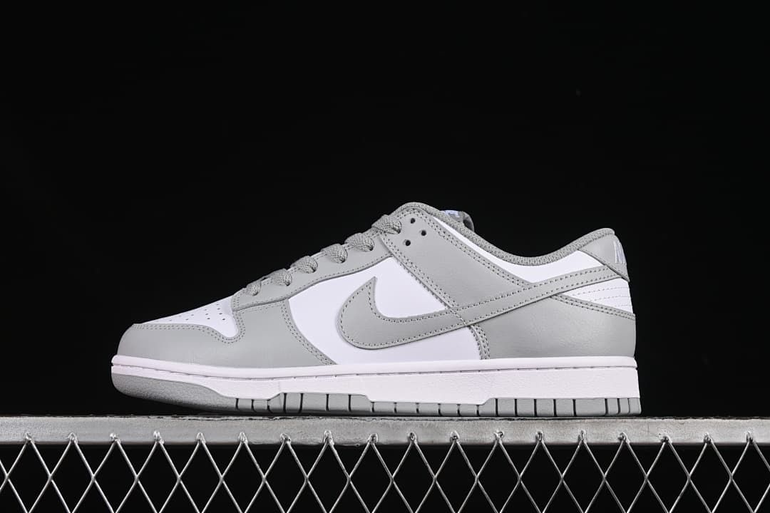 Side profile of the white and grey low-top sneaker