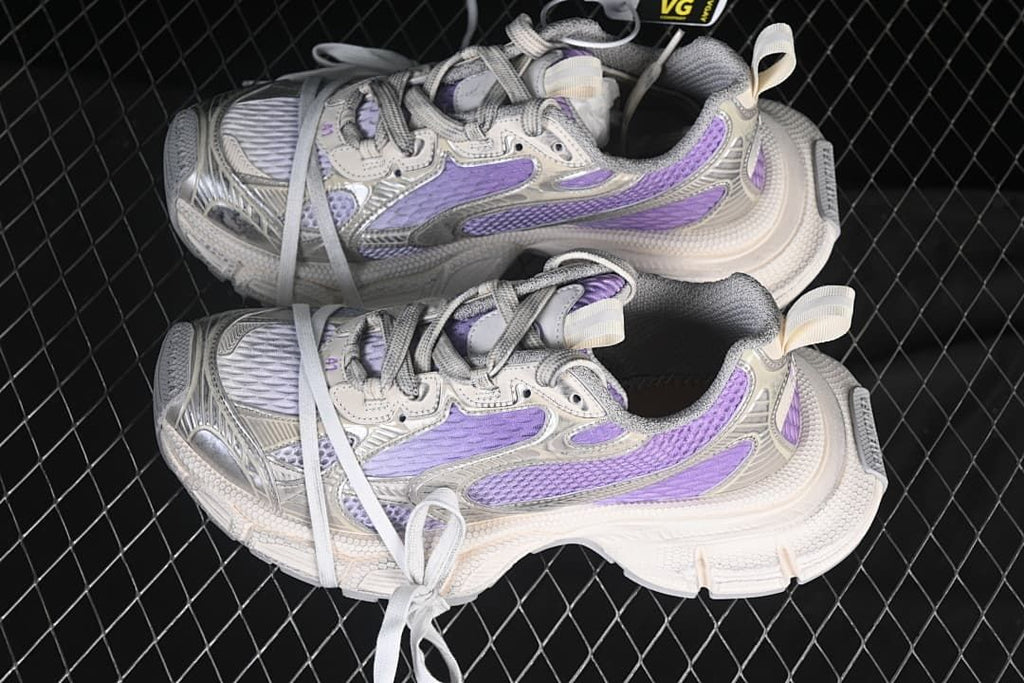 Pair of lilac and off-white sneakers shown from above.