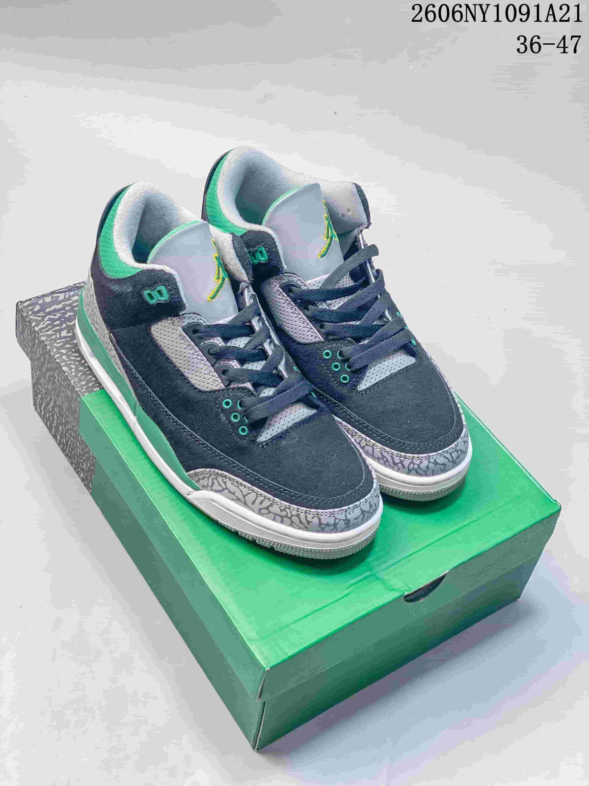 Pair of navy, grey, and green Air Jordan 3 mid-top sneakers shown from the front three-quarter view