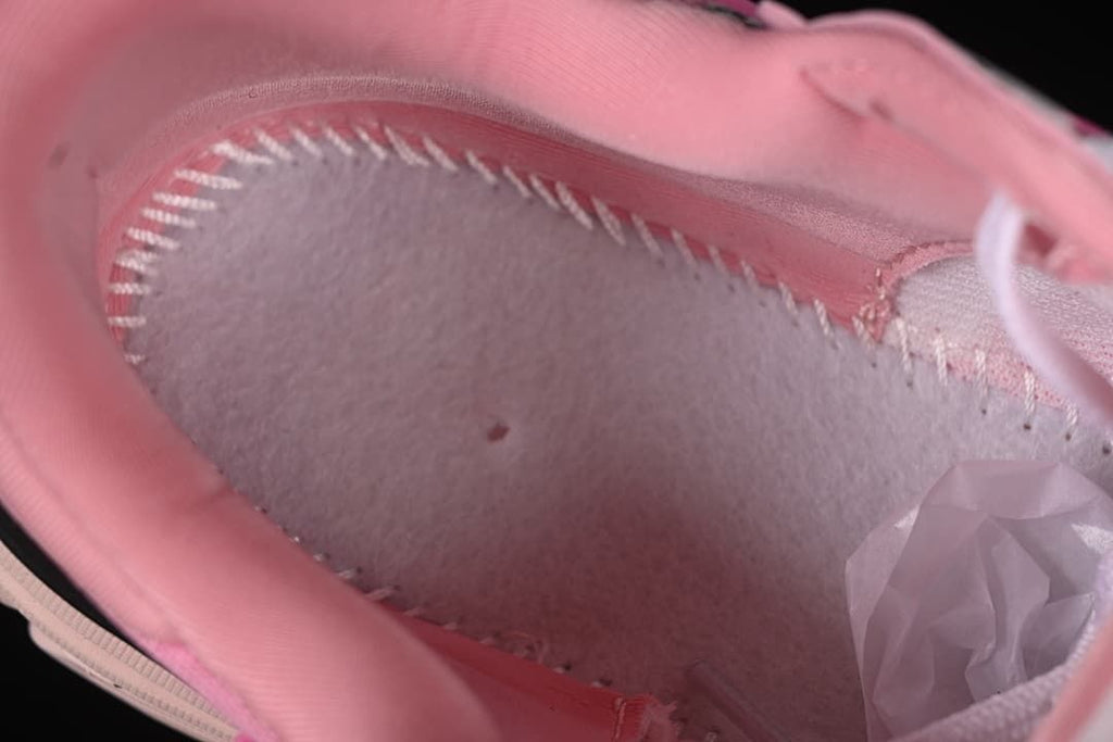 Close-up of the pink sneaker's interior stitching and lining