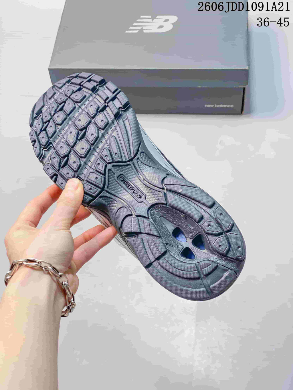 Underside of a New Balance 740 sneaker showing its patterned outsole