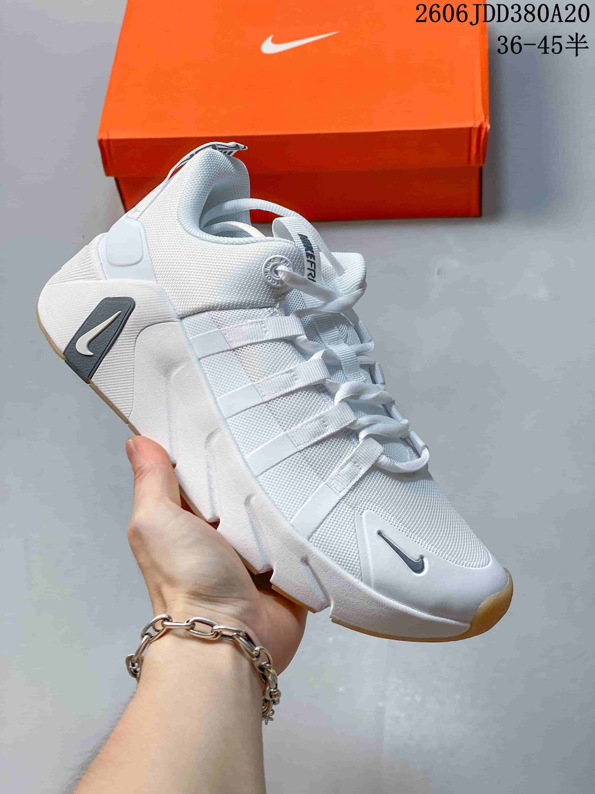 White Nike Free Metcon 7 shoe with dark gray accents
