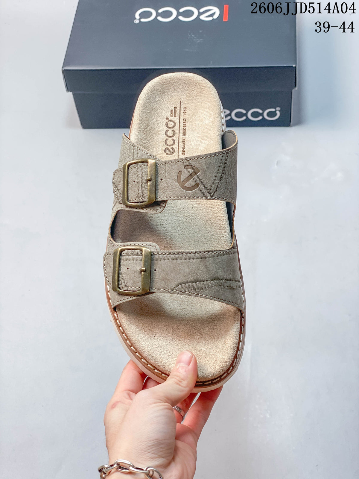 Top view of a taupe slide sandal with two buckle straps and a light footbed; image overlay shows 06JJD514A04 and sizes 39–44.