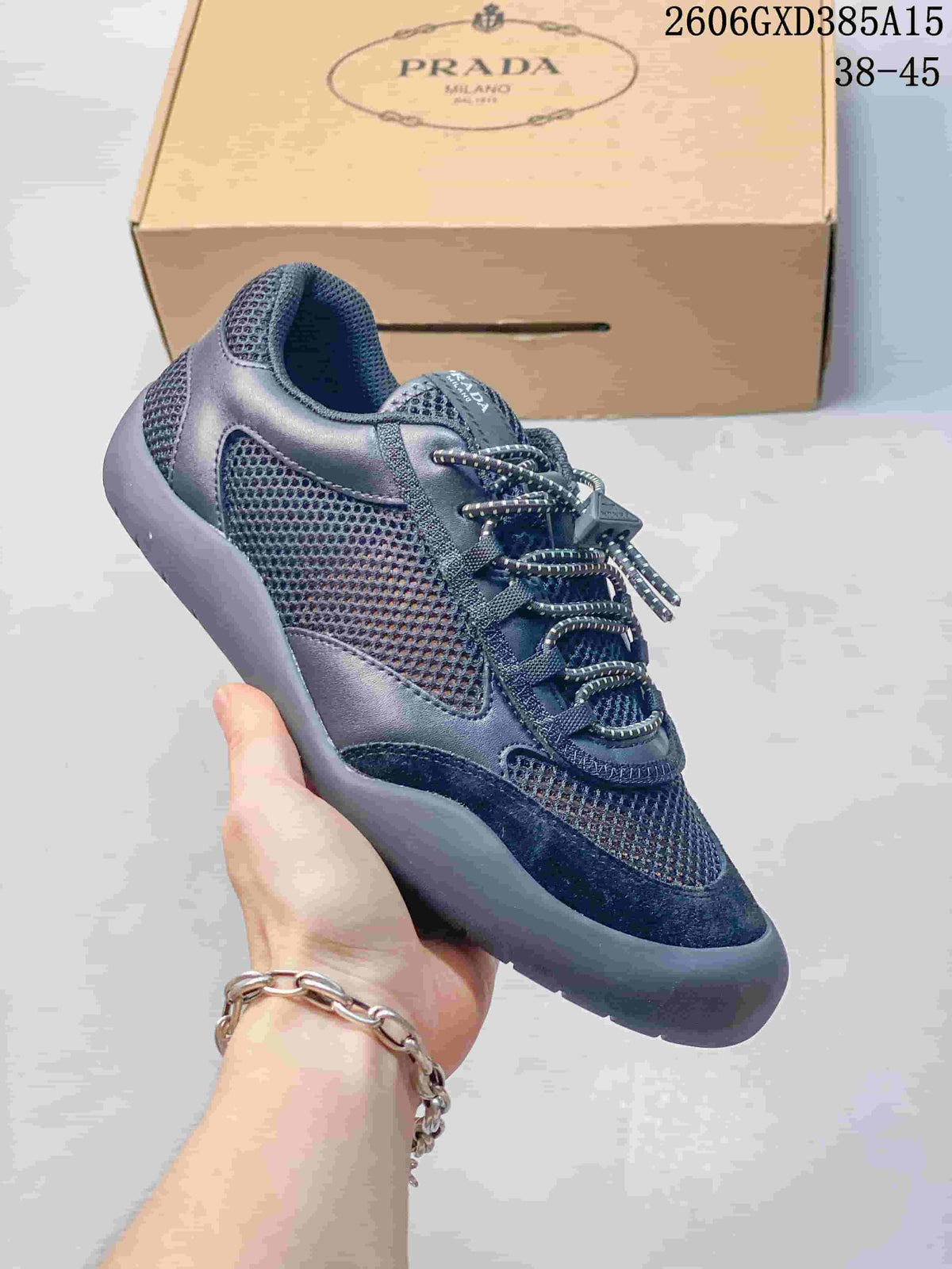 Close view of a dark navy sneaker with mesh panels and lace-up fastening