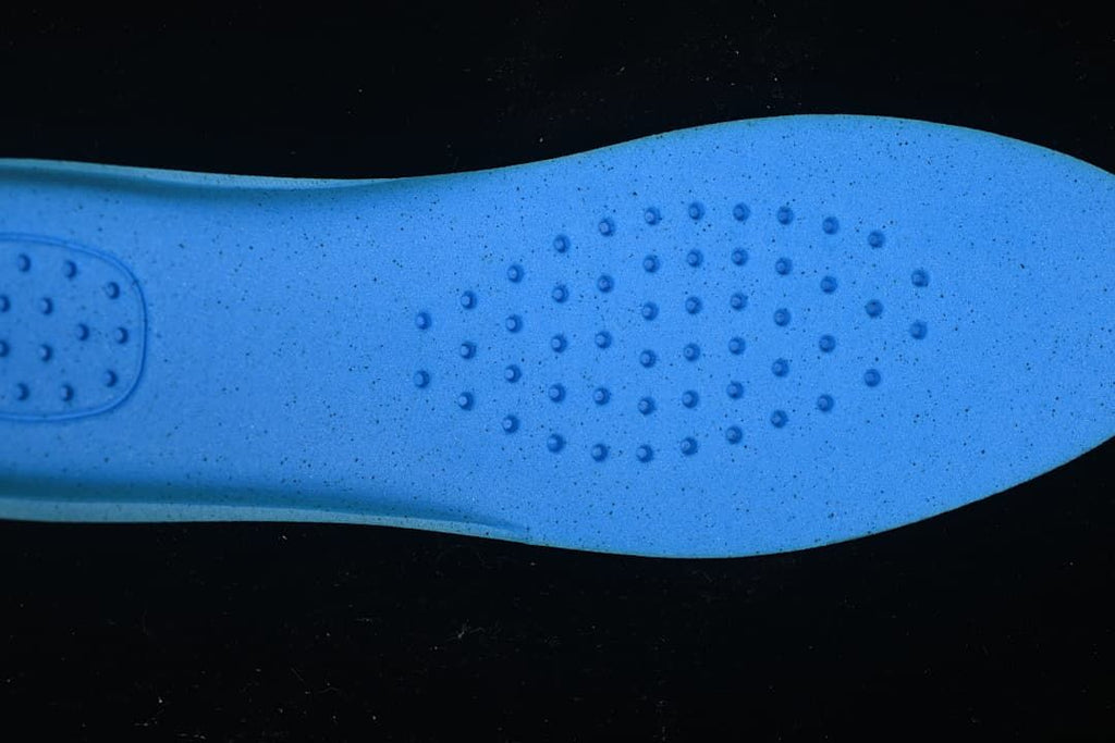 Blue insole surface with a pattern of raised circular details