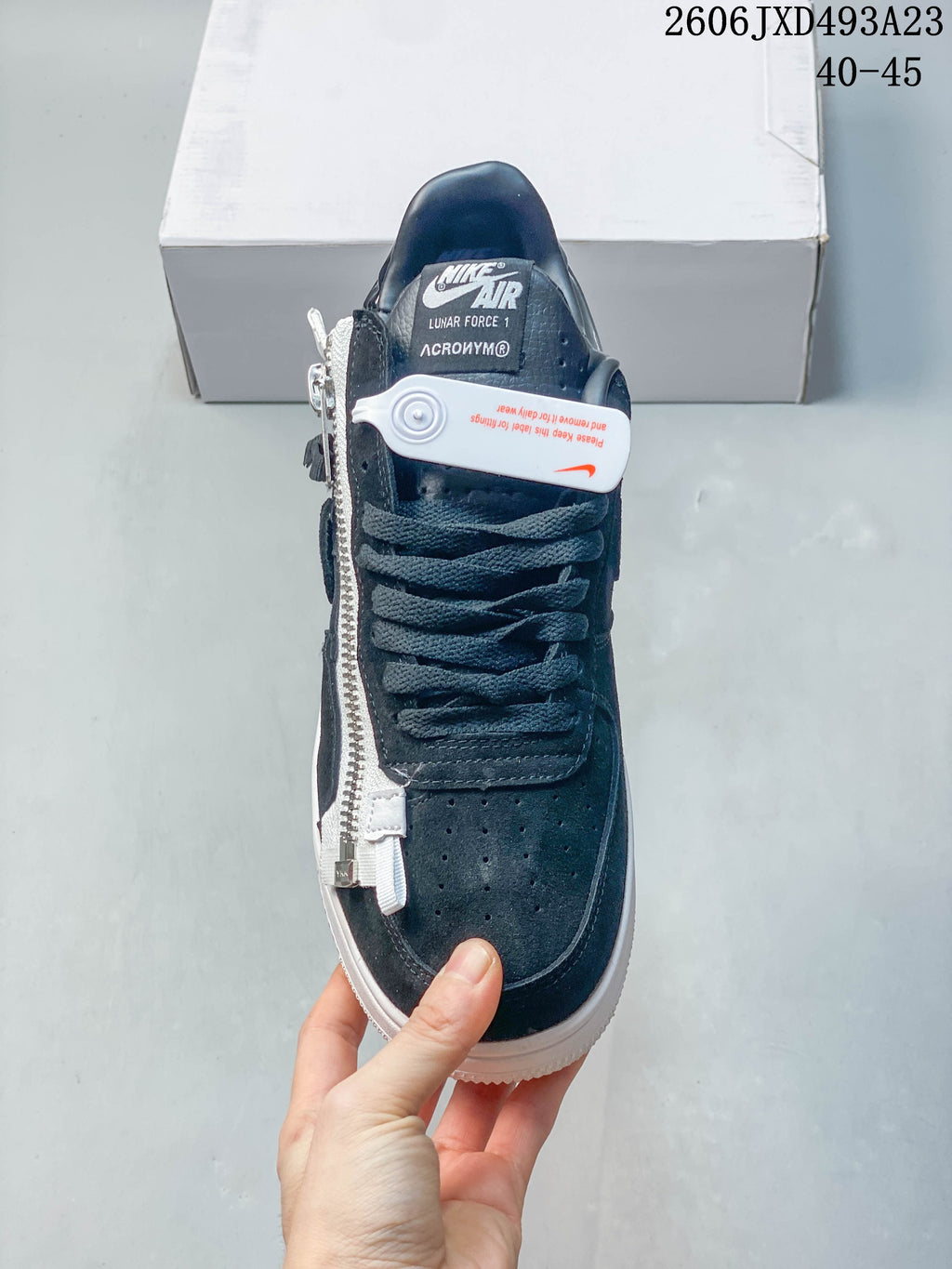Top view showing perforated toe, laces, side zipper and tongue label.