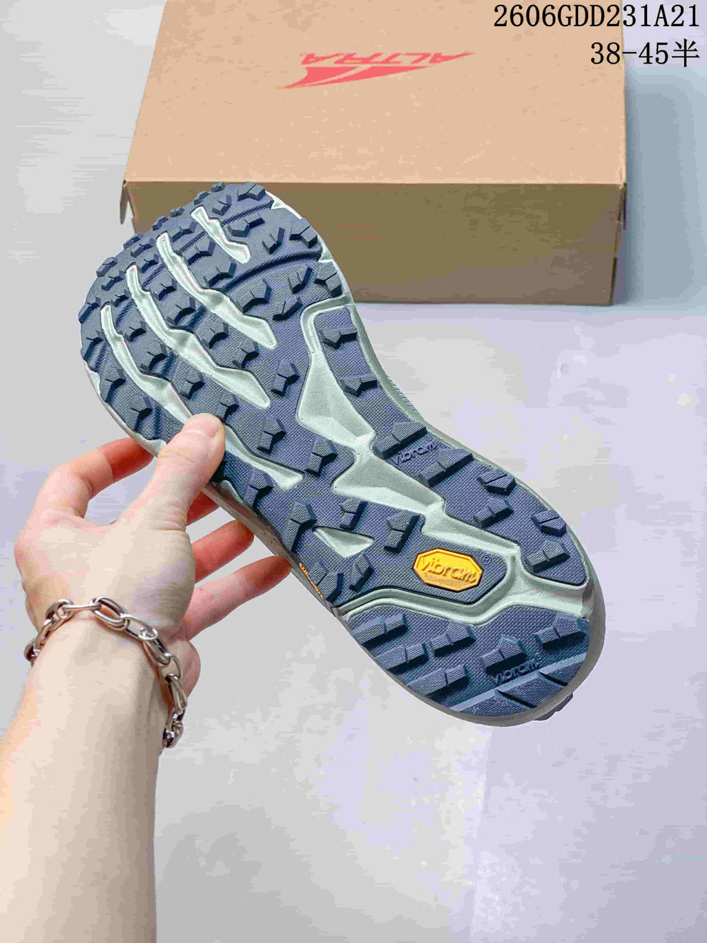 Underside showing the lugged outsole and Vibram branding