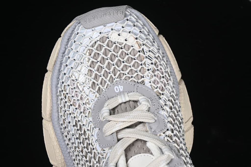 Top view of the sneaker showing lacing and openwork upper