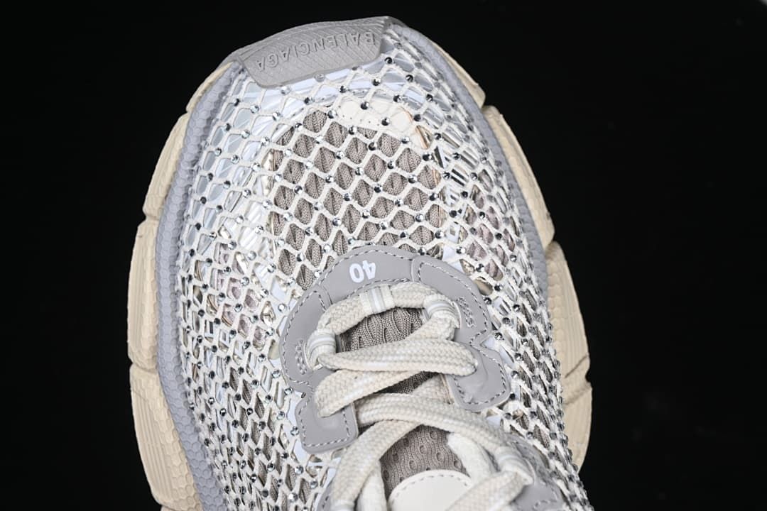 Top view of the sneaker showing lacing and openwork upper