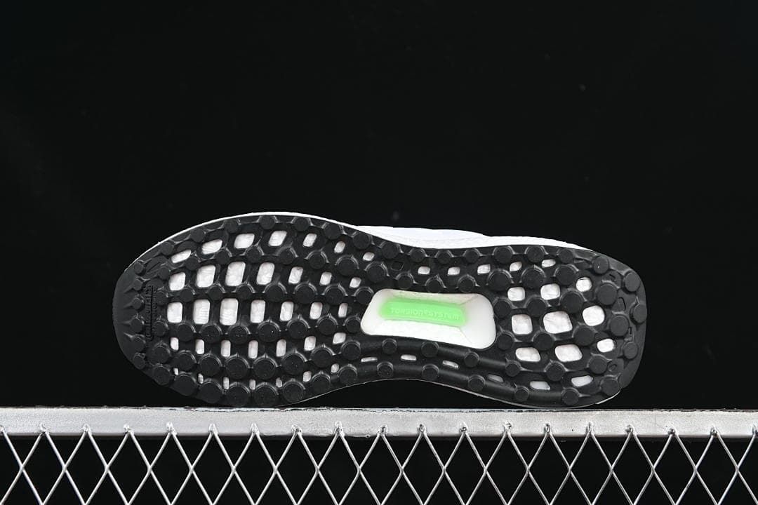 Underside view showing the black patterned outsole.