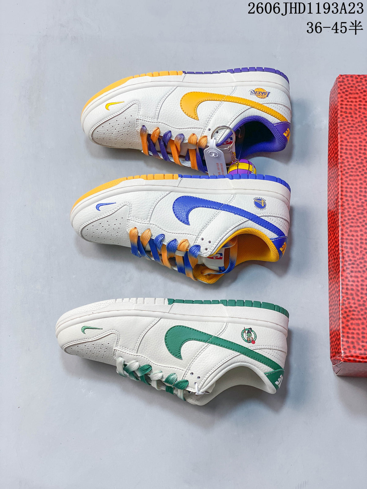 Three white low-top sneakers displayed in blue and yellow, purple and gold, and green color combinations.