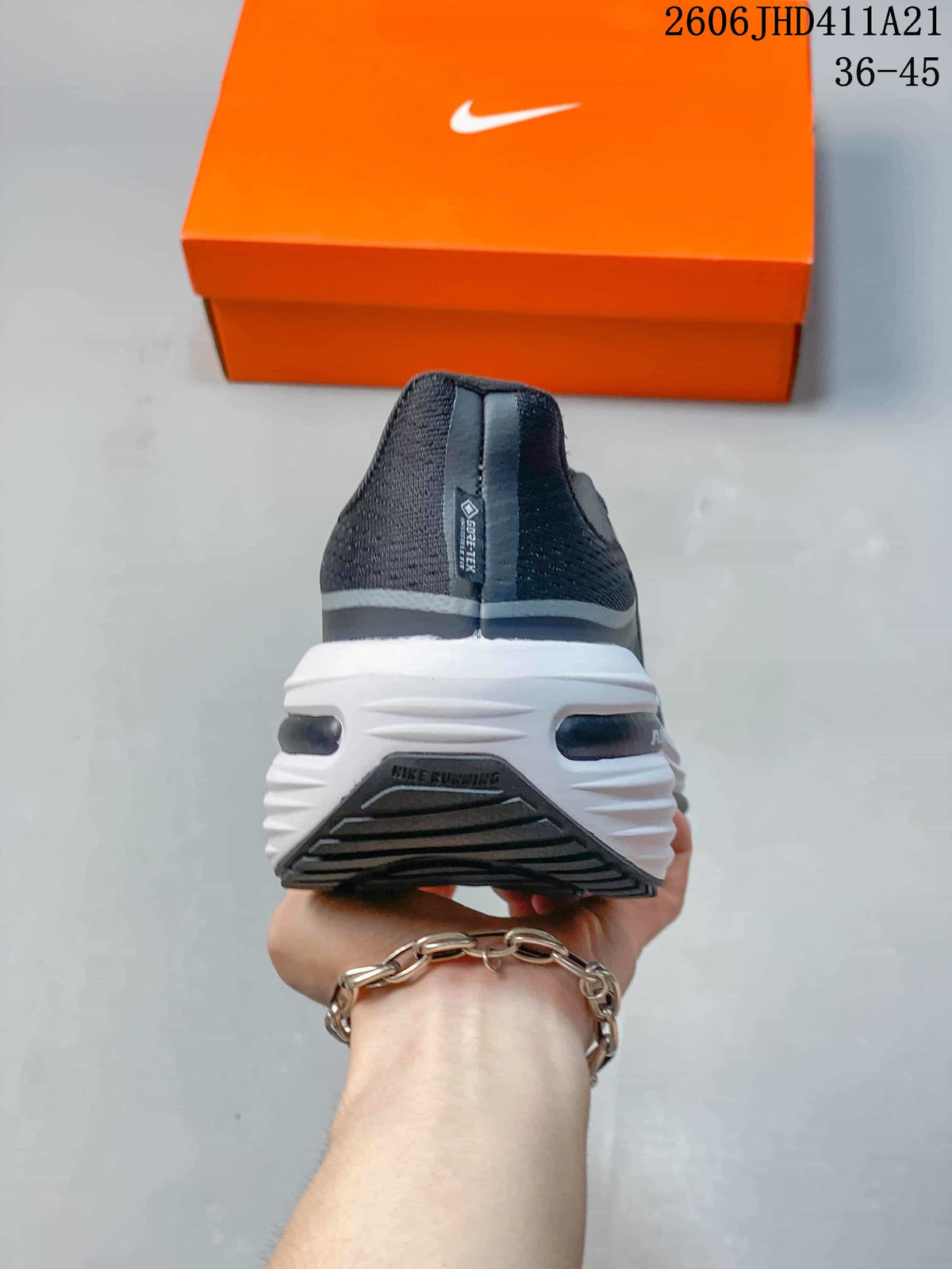 Rear view of a dark gray running shoe with a sculpted white midsole; image label shows 36–45.