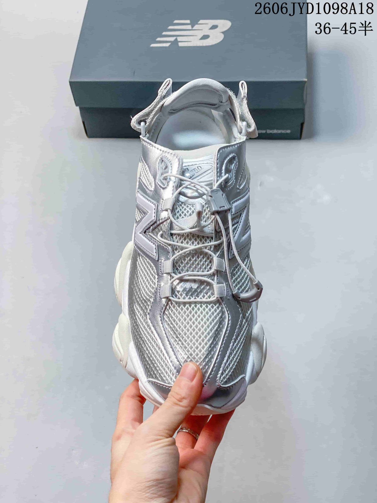 Front view of the sneaker showing mesh panels and toggle laces.