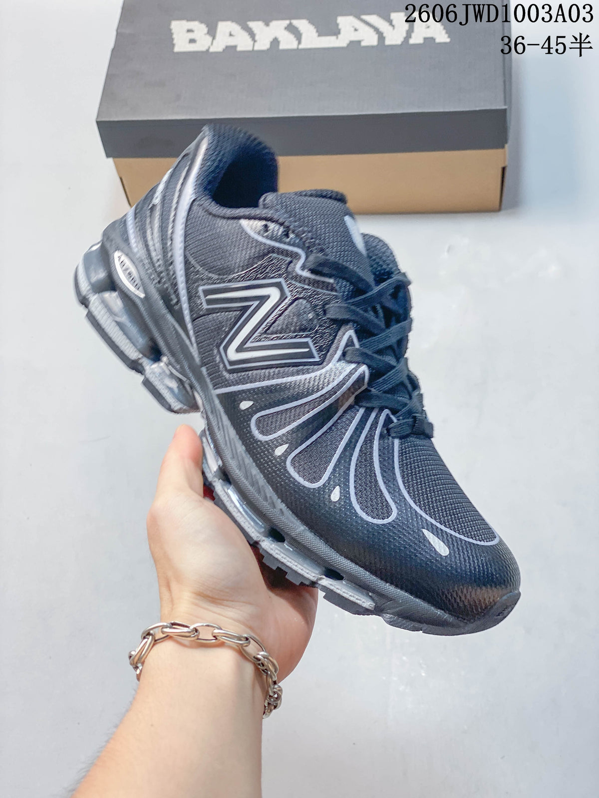 Angled side view of the dark gray low-top sneaker with its sculpted sole.