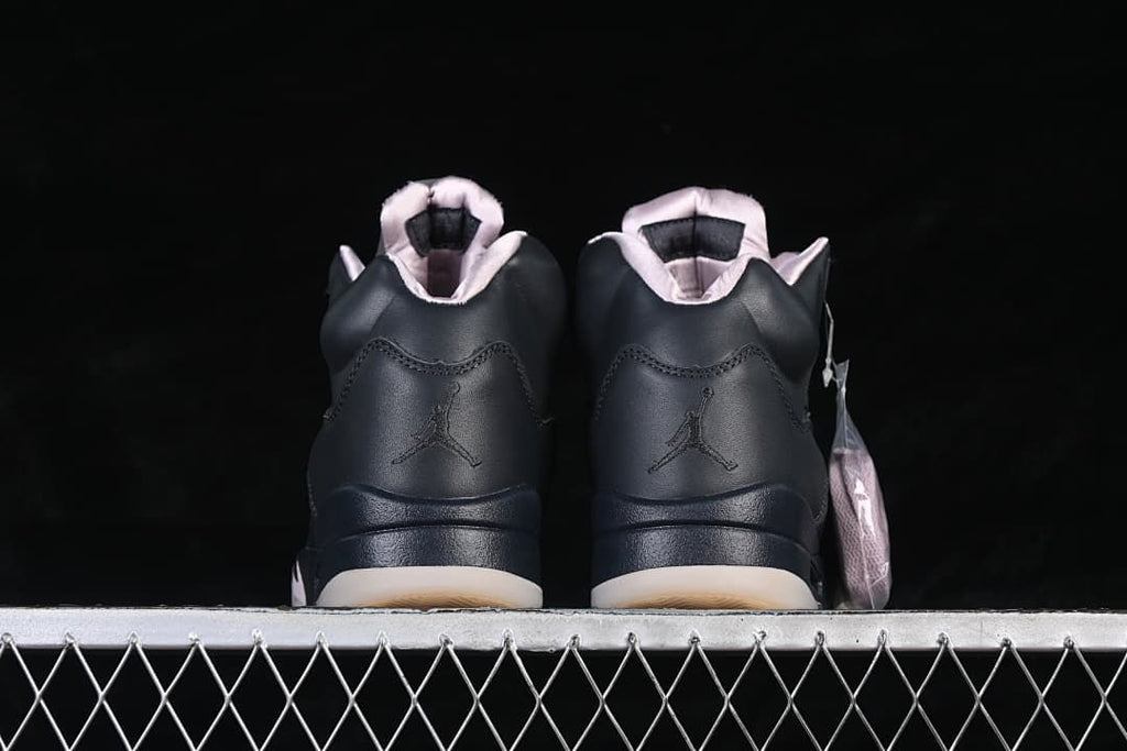 Rear view of the pair showing heel logos and pale-colored collar lining