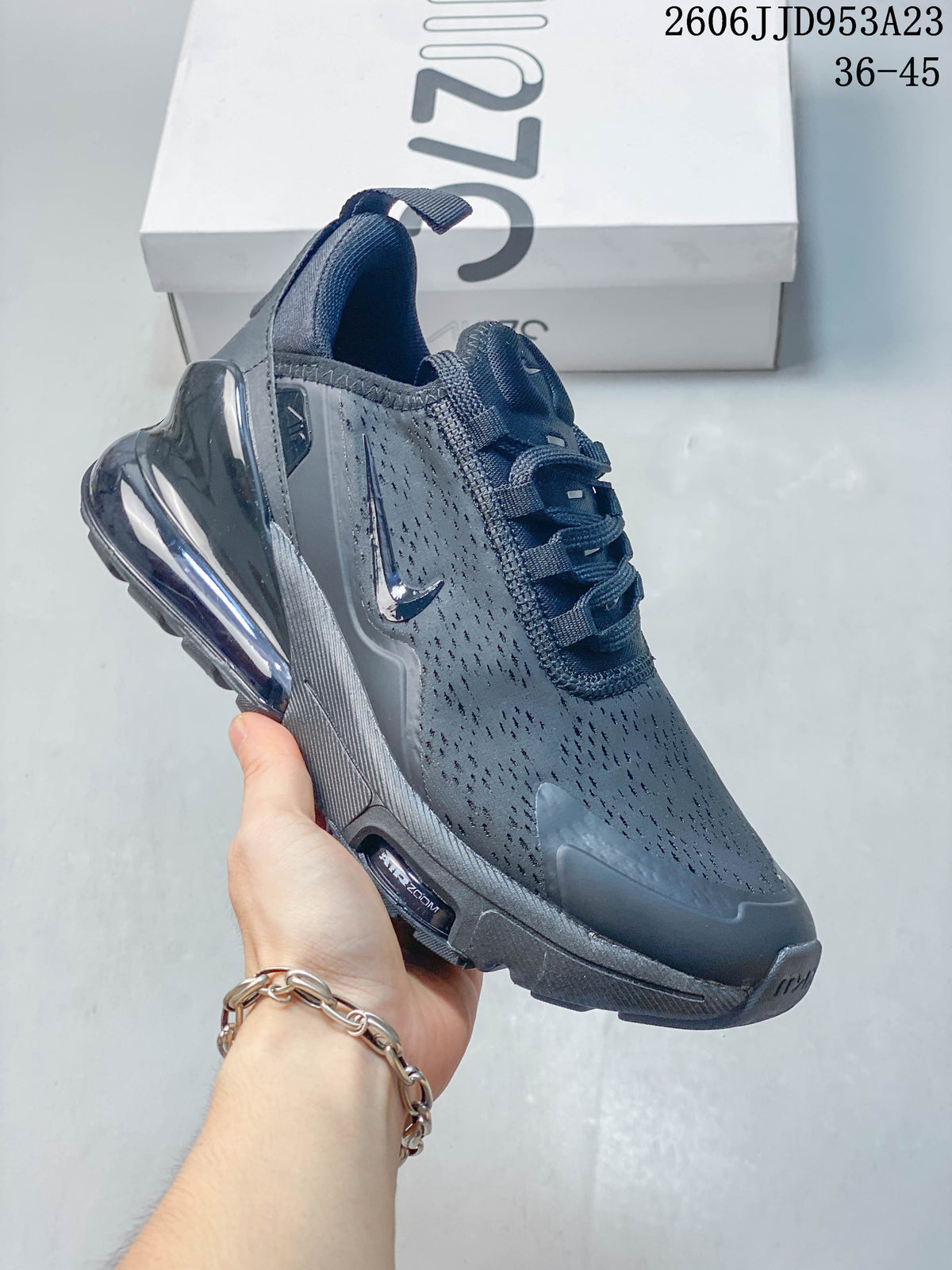 Side view of a dark gray Nike Air Max 270 sneaker with a visible heel air unit.