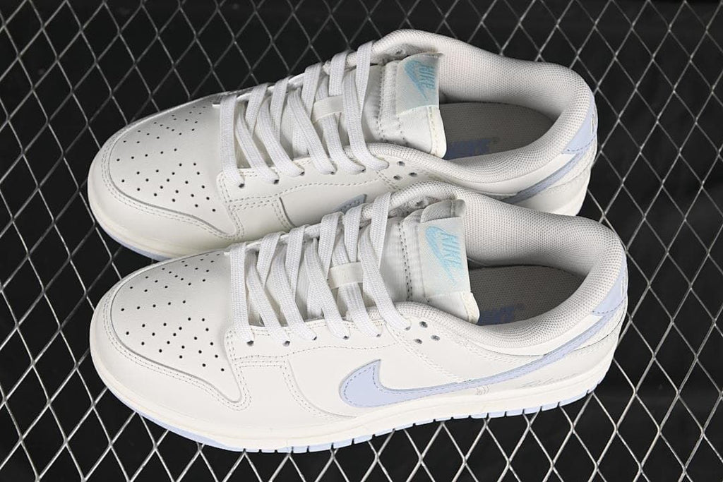 Pair of white and light blue low-top sneakers