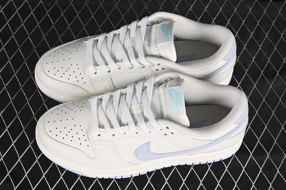 Pair of white and light blue low-top sneakers