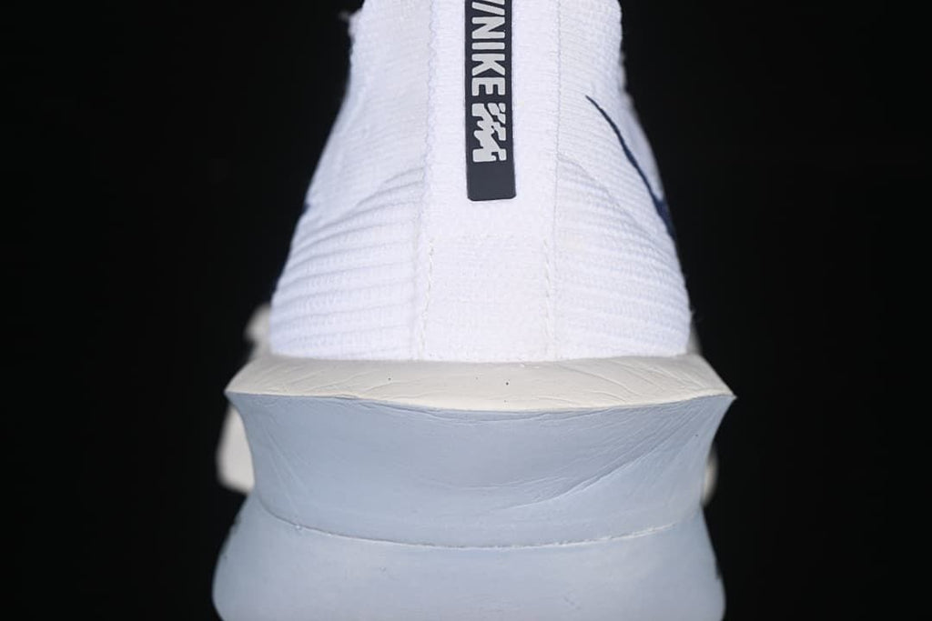 Rear view showing the heel pull tab and sculpted midsole