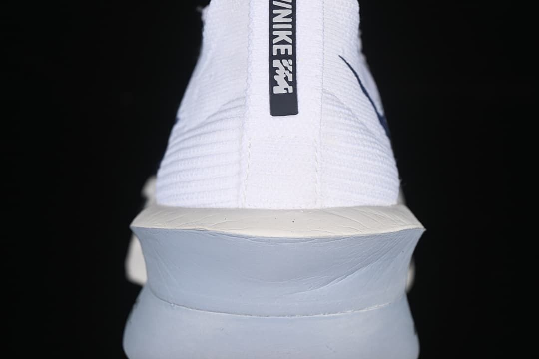 Rear view showing the heel pull tab and sculpted midsole