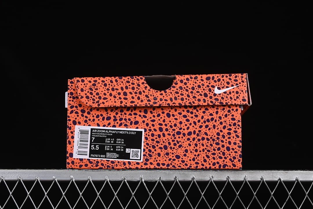Orange-and-black speckled shoe box with a label identifying the Air Zoom Alphafly NEXT% 3.