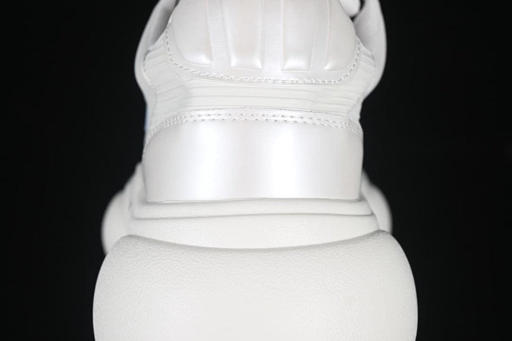 Rear view showing stitched heel panels and the thick sole