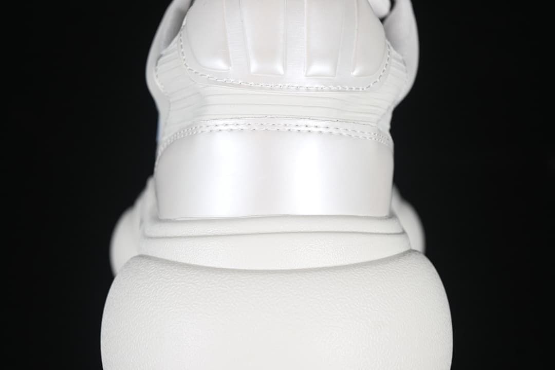 Rear view showing stitched heel panels and the thick sole