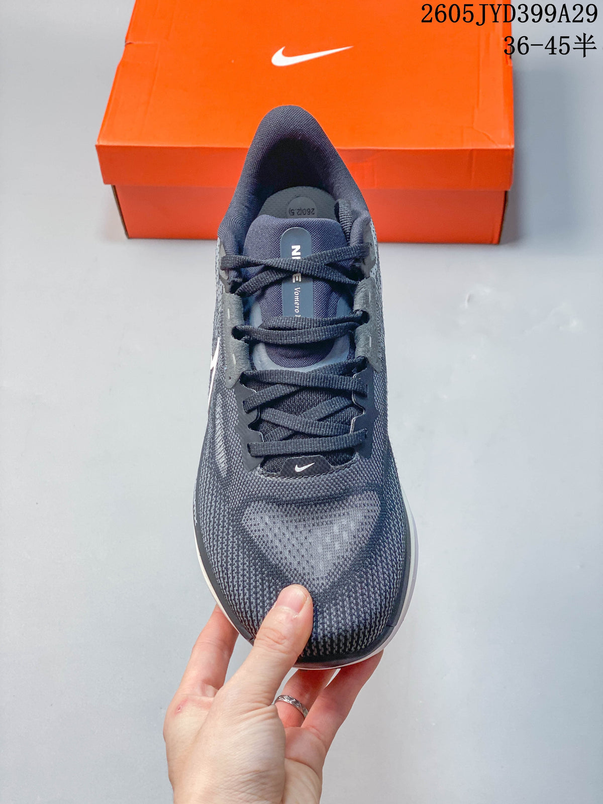 Top view of the grey running shoe with dark laces