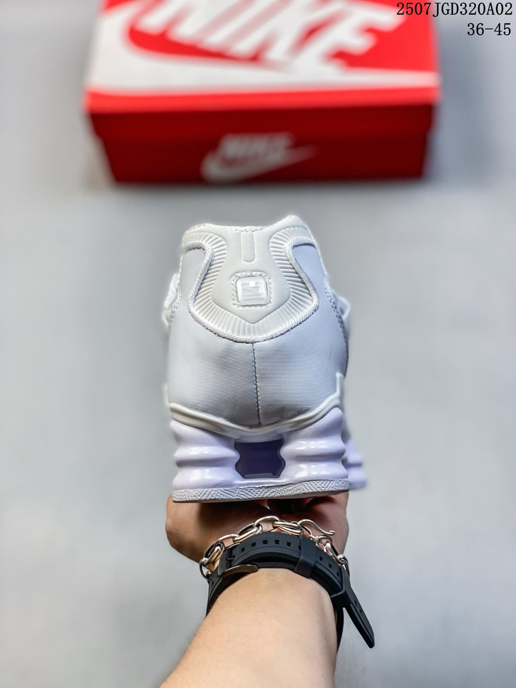 Rear view of the white sneaker and its sculpted heel