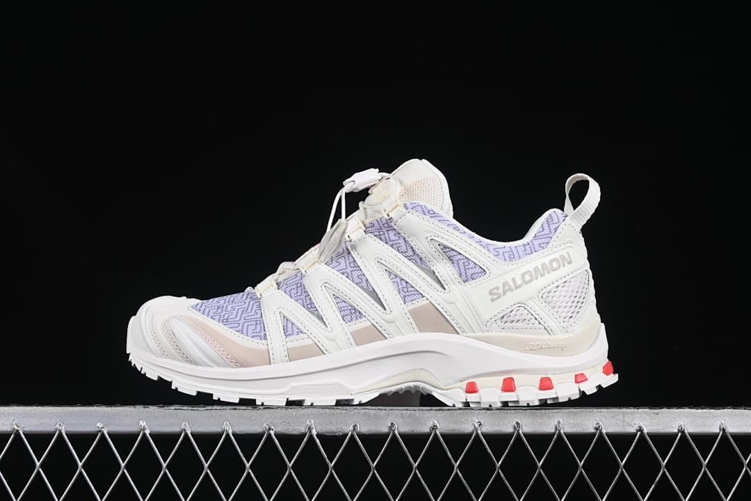 Side profile of a Salomon XA Pro 3D shoe in a light colorway with lavender panels and red outsole accents.