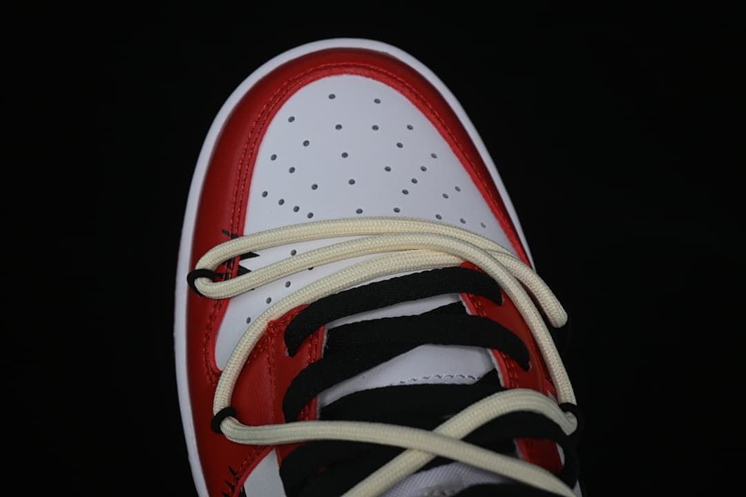 Top view of the perforated toe and crossed laces