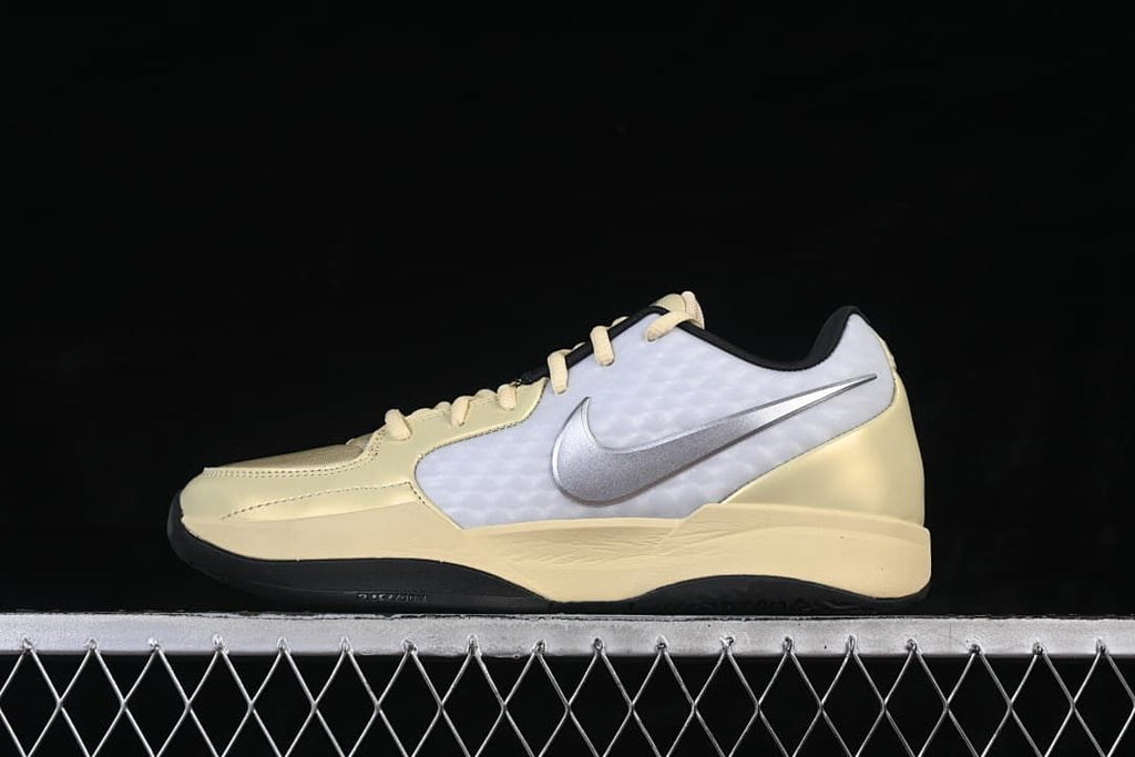 Side view of pale yellow, white, and silver Nike Ja 2 basketball shoe