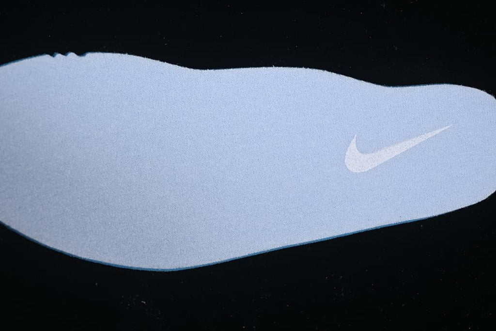 Light-colored shoe insole with a Swoosh detail