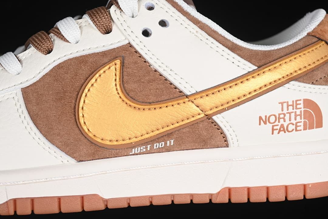 Close-up of golden-yellow Swoosh, brown side panel, and printed branding