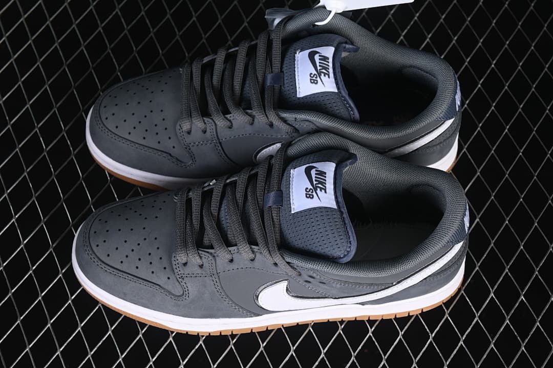 Pair of gray Nike SB Dunk Low sneakers viewed from above.