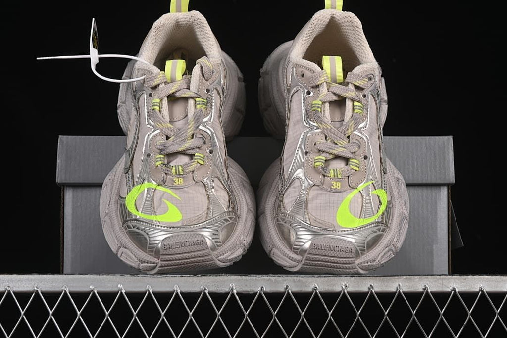 Front view of the pair showing the chunky toe and fluorescent yellow accents