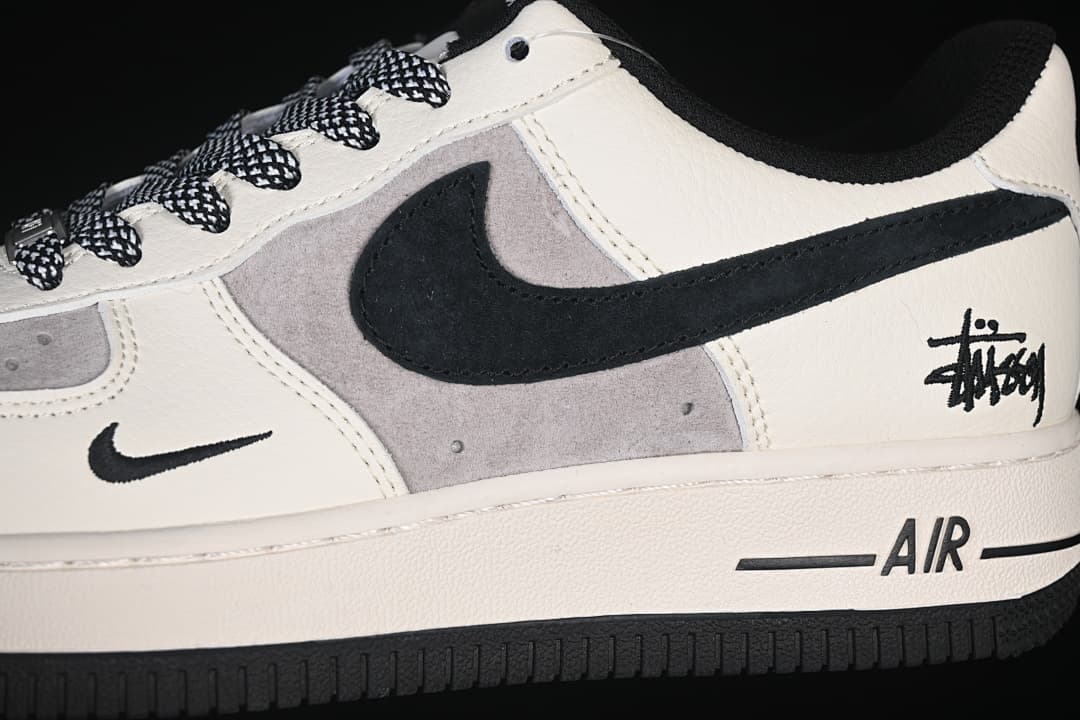Close-up of the grey side panels, black Swoosh, and heel graphic.