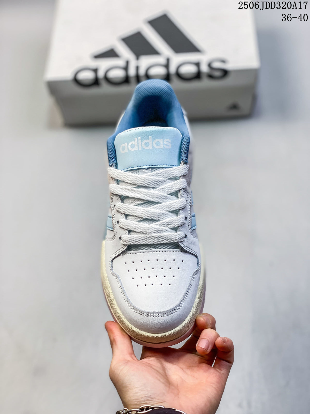 Top view of the perforated toe, white laces, and blue tongue of an adidas Entrap sneaker.
