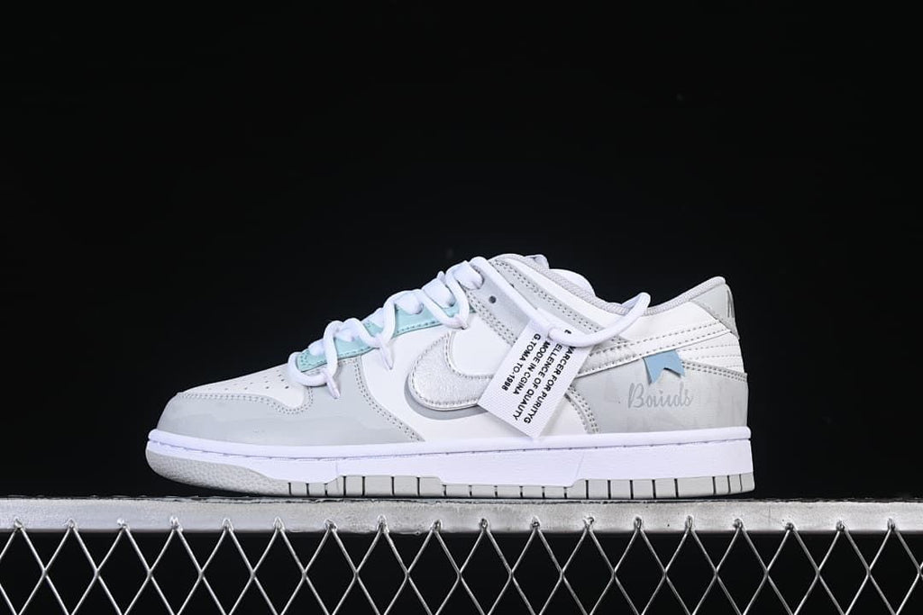 Opposite side profile showing the Swoosh and pale aqua accents